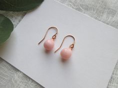 Pretty and Dainty Pink Peruvian Opal Teardrop Pearl Earrings. These are natural pink Opal, October birthstone, gorgeous lovely soft pink with some darker pink shaded. ITEM SPECIFICATIONS : * Length of earring: approx. 20mm * Material: 925 Sterling Silver * Finish: 14K Gold Filled, 18k Rose Gold Filled or 925 Sterling Silver * Size of Pink Opal: 8x9mm How to order: 1. Select the material finish you like. 2. Select the style of earrings you like. If you like a pendant to match, we can craft them as well, please contact us. Earrings are considered as Intimate items and can not be returned due to health/hygiene reasons. A ribbon jewelry box is provide for free ready for gifting, if you like us to hand write a hearty note, a heart shape card will be provided too, just drop the note in message b Classic Pink Drop Jewelry, Elegant Pink Gold Jewelry With Ear Wire, Delicate Rose Gold Drop Earrings, Hypoallergenic Rose Gold Earrings For Formal Events, Elegant Pink Gold Hypoallergenic Jewelry, Elegant Hypoallergenic Pink Gold Earrings, Elegant Hypoallergenic Pink Gold Jewelry, Teardrop Pearl Earrings, Pink Opal Earrings