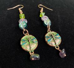 These handmade earrings give off a spring and whimsy vibe. They consist of charms, glass and acrylic beads, and wire! They are drop earrings that hang roughly 2.5 inches from the hook. * * SHIPPING: If you order earlier in the day there is a higher chance of it getting shipped that day, if ordered after 5 pm EST then it will be shipped out the next day! * INSTAGRAM: If you are interested in seeing more jewelry before it hits Etsy check out my Instagram: @ 2thevoid_art - https://www.instagram.com Dragonfly Earrings, I Love Jewelry, That Day, Beads And Wire, Acrylic Beads, Handmade Earrings, Boho Jewelry, Earrings Handmade, Beaded Earrings