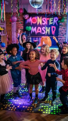 children in costumes dancing on a dance floor