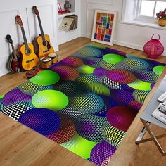 a colorful area rug in the middle of a room with guitars and guitars on the wall