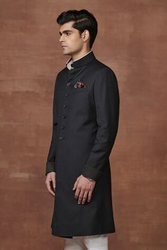 Black achkan crafted from fine pinstriped black wool textured fabric with contrast fabric and stitch lines cuff details. - Aza Fashions Classic Black Formal Kurta, Classic Black Bandhgala For Work, Black Semi-formal Kurta For Winter, Fitted Black Kurta With Stand Collar, Black Semi-formal Winter Kurta, Fitted Black Bandhgala With Stand Collar, Classic Black Long Sleeve Bandhgala, Black Semi-formal Sherwani For Winter, Semi-formal Black Sherwani For Winter