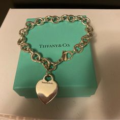 Never Worn Yet 9 Inch Size Large Tiffany And Co Authentic Bracelet Heart Charm Is Engrave-Able I Have The Return To Tiffany One So Haven’t Worn This Does Not Come With Box Or Card Or Tissue Just The Beautiful Bracelet Luxury White Gold Heart Bracelet, Luxury Silver Heart Cut Bracelet, Luxury Silver Heart Bracelet For Valentine's Day, Luxury Heart-shaped Bracelets For Formal Occasions, Luxury Heart-shaped Formal Bracelets, Luxury Heart-shaped Bracelet For Formal Occasions, Luxury Heart Bracelet For Valentine's Day Formal, Luxury Formal Heart-shaped Bracelets, Luxury Heart Bracelet For Wedding