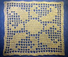 a yellow crocheted doily on blue fabric