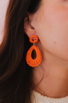 Features a vibrant orange raffia earring. -Length: 2.5" -Post back Woven Red Jewelry For Summer, Red Woven Jewelry For Summer, Coral Earrings For Summer Beach Occasion, Coral Earrings For Beach Summer, Coral Earrings For Beach And Summer, Orange Summer Earrings For Vacation, Orange Earrings For Spring Beach Outing, Summer Beach Coral Earrings, Vibrant Orange Summer Earrings