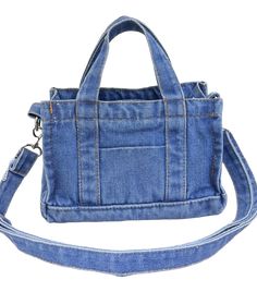 a blue denim bag is shown on a white background and has a strap around it