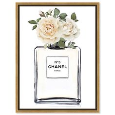 a chanel bottle with flowers in it