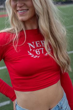 Get ready for gameday with this new FSB exclusive- the NEB 67 Long Sleeve Crop! This red cropped tee is available in size small-large! machine wash cold hang to dry Model is wearing a size small Tailgate Outfit, Romantic Cards, Mom Cards, Dad Cards, Cropped Tee, Midi Maxi Dress, Long Sleeve Crop, Party Photos, Denim Pant