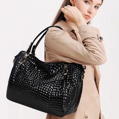 Step out in style with the Christine Genuine Leather Tote Bag! Its crocodile pattern, exquisite details, and elegant design make it a must-have piece that can match any outfit. With its large capacity and high-quality leather material, this tote bag is both practical and sophisticated. This bag will make you feel confident and classy wherever you go! Exclusively available in black. Luxury Handheld Shoulder Bag With Crocodile Pattern, Elegant Shoulder Bag With Top Handle And Crocodile Pattern, Elegant Office Shoulder Bag With Crocodile Pattern, Elegant Crocodile Pattern Shoulder Bag For Office, Luxury Crocodile Pattern Shoulder Bag For Daily Use, Crocodile Pattern Tote Shoulder Bag For Shopping, Chic Crocodile Pattern Shoulder Bag For Shopping, Chic Shoulder Bag With Crocodile Pattern For Professionals, Chic Crocodile Pattern Shoulder Bag For Business