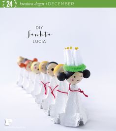 a group of small figurines in the shape of people