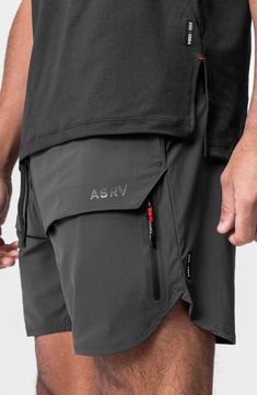 These water-resistant shorts are lightweight, linerless and made of four-way-stretch fabric for effortless movement. A technical front overlay panel partially conceals two vertical zip pockets to securely store your essentials while a handy utility loop holds a towel or shirt. 7" inseam; 22" leg opening; 13 front rise; 15" back rise (size Medium) Drawstring waist Utility loop holds shirt or towel Water resistant 76% nylon; 24% spandex Machine wash, line dry Imported Activewear Details, Activewear Trends, Men Activewear, Collection Ideas, Boxing Club, Gym Inspo, Sports Graphic Design, Shirt Print Design, Training Shorts