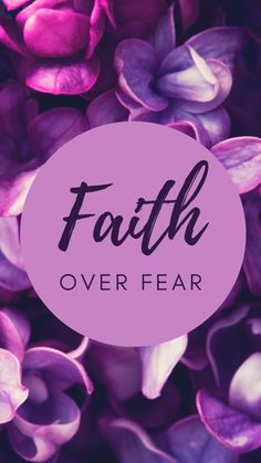 the words faith over fear surrounded by purple flowers