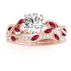 a rose gold wedding ring set with an oval cut diamond surrounded by red ruby stones