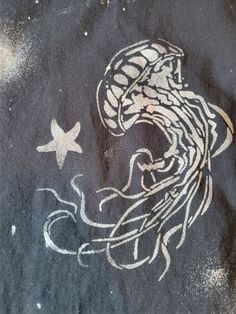 an image of a drawing on the ground with stars and jellyfishs in it