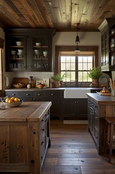 a kitchen with wooden floors and dark cabinets