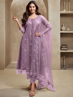 Elevate your wardrobe with our Amyra Dastur Lavender Floral Kurta. Made from a luxurious silk blend, this A-line kurta boasts exquisite floral embroidery and a scalloped hem for a sophisticated touch. Complete with trousers and a dupatta, this ensemble exudes grace and elegance. Perfect for any occasion. Elegant Purple Long Sleeve Anarkali Set, Festive Elegant Lavender Kurta, Festive Lavender Elegant Kurta, Unstitched Lavender Sets For Eid, Lavender Semi-stitched Sets With Intricate Embroidery, Traditional Lavender Floral Embroidered Dupatta, Traditional Lavender Set With Intricate Embroidery, Traditional Lavender Sets With Intricate Embroidery, Purple Sets With Floral Embroidery