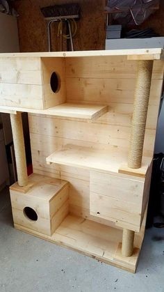 a cat house built into the side of a garage