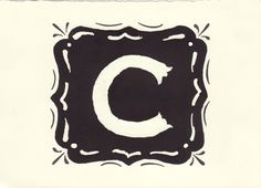 the letter c is painted in black and white