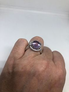 Unusual Deep Toned huge Amethyst Sterling Filigree Setting Accented with White Handmade Size 6 Can be resized, my jeweler charges $10-$20 All rings are shipped in a nice gift box. Check out our over a THOUSAND great reviews Engraving is $4 per letter and is not always perfect depending on the piece. It can take a few days if the jeweler is busy. This is payable to Paypal Judithsltd@gmail.com Dazzling Round Amethyst Ring For Gift, Collectible Purple Amethyst Ring With Center Stone, Purple Gemstones With Halo Setting, Collectible Stamped 925 Amethyst Ring, Ornate Purple Amethyst Ring, Ornate Silver Amethyst Ring, Antique Hallmarked Purple Rings, Victorian Sterling Silver Hallmarked Amethyst Ring, Antique Hallmarked Amethyst Ring In Sterling Silver