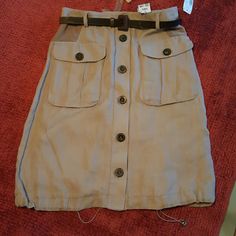 Great Suede And Canvas Khaki Skirt With Toggle Pulls At Hem So That You Can Wear This As A Bubble Skirt Or A Traditional Skirt. Pockets On Front And Back And Beautiful Contrast Fabric On Yolk Of Skirt. Falls At The Knee. Traditional Skirts, Skirt Pockets, Khaki Skirt, Bubble Skirt, Heel Boots, Tan Brown, The Knee, High Heel, Button Downs