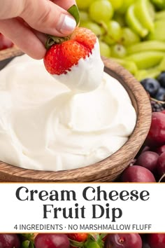 cream cheese fruit dip with berries and grapes in the background