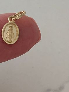 14K Solid Gold Virgin of Miracles | Yellow Gold Virgin | Catholic Pendant | 14K Virgen de la Milagrosa  ⁙ Materials: 14K Yellow Gold ⁙ Dimensions: 7.5MM Height by 6MM Width in Diameter ⁙ Pendant hoop: 3MM Production Times: ⁙ Order processing time varies between 1-3 business days ⁙ All orders placed on Saturday, Sunday, or on a national holiday will begin processing the following business day National Holiday, Pompano Beach, Change Of Address, Saturday Sunday, Jump Rings, Solid Gold, Jewelry Necklace Pendant, Jewelry Necklaces, Yellow Gold