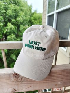 Adult sized unstructured dad hat (buckleback adjustable closure 21"-25" circumference) (25 assorted colors) with "I JUST WORK HERE" embroidered on the front of the cap. If you have a font that you'd like or anything changed (i.e. change to cursive or not all caps) let me know, I'd be happy to customize it! :)  . . . If you would want anything changed, please make note of it in the order, I do most of these made to order so don't be afraid to customize it! :) All orders are made in the order they I Just Work Here, A Font, Virtual Closet, Cute Fits, Dad Hat, Be Afraid, Trucker Cap, Dad Hats