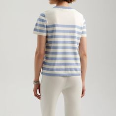 Discover Elegance and Comfort Embrace a blend of elegance and casual style with our Striped Knit T-Shirt, perfect for the modern woman. Designed to enhance your summer wardrobe, this top features a classic striped pattern that complements any outfit, making it a must-have for your fashion lineup. Product Features Fabric Composition: Crafted from a mix of polyester, viscose, and polyamide, offering a soft, breathable feel with slight stretch for comfort. Design: Timeless black and white stripes with a slim fit design to accentuate your silhouette. Convenience: Easy to care for and maintains its shape, even after multiple washes. Versatility: Ideal for various occasions, from casual outings to more formal settings. Size Bust Shoulder Sleeve length Length Unit CM Inch CM Inch CM Inch CM Inch Chic Striped Crew Neck T-shirt, Cotton V-neck Tops With Contrast Stripes, Cotton V-neck Top With Contrast Stripes, White Elegant Top With Contrast Stripes, Chic Knit T-shirt For Spring, Elegant White Top With Contrast Stripes, Chic Summer Tops With Vertical Stripes, Chic Vertical Stripes Tops For Summer, Trendy Striped Crew Neck Knit Top