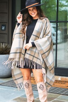 Keep warm this season in our trendy plaid poncho! These cozy plaid ponchos feature fringe along the bottom hem and an open front perfect for versatile layering. Made with a super-soft polyester and acrylic material, this poncho creates a trendy look that's easy to mix and match with your basic monogrammed tops and monogrammed boots. It is a one size fits most style and looks great paired with our Monogrammed Tunic Shirt! Oversized Winter Outerwear With Frayed Hem, Oversized Outerwear With Frayed Hem For Winter, Fringed Long Sleeve Poncho For Fall, Fringe Long Sleeve Poncho For Fall, Long Sleeve Fringe Poncho For Fall, Plaid Winter Poncho, Winter Plaid Poncho, Casual Fall Shawl Poncho, Casual Shawl Poncho For Fall