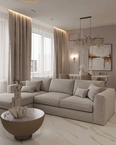 a living room filled with furniture and a chandelier