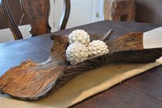 a piece of wood sitting on top of a table