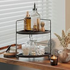 two tiered trays with bottles and candles