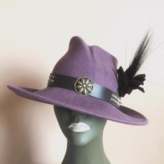 The allure of a well made fedora. A modern fedora is created in mauve wool felt imported from Poland. Hand-crafted in USA with adjustable headband. The feather is not sewn and the hat can also be worn without it . Party Fedora Hat In Felt, Felt Fedora For Kentucky Derby, Kentucky Derby Felt Fedora Hat, Adjustable Flat Brim Purple Felt Hat, Adjustable Purple Felt Hat With Short Brim, Adjustable Purple Felt Hat With Flat Brim, Purple Adjustable Flat Brim Felt Hat, Adjustable Wide Brim Purple Fedora, Adjustable Purple Brimmed Fedora