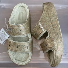 Brand New Crocs Classic Cozzzy Glitter Sandal 208124-93s. Gold Glittery. Size Women’s 11 Or Men’s 9. Slides Style That Hold Crocs Charms. From A Smoke-Free Home. Casual Flat Glitter Sandals, Casual Glitter Sandals For Spring, Casual Glitter Sandals With Synthetic Material, Casual Glitter Synthetic Sandals, Casual Glitter Sandals, Casual Open Toe Glitter Sandals, Crocs Charms, New Crocs, Shoes Crocs