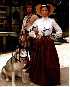 a man and woman standing next to a dog wearing cowboy hats with the words love, person written on it