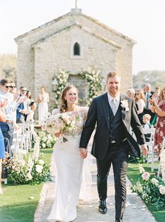 a newly married couple walking down the aisle