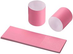 two rolls of pink paper next to each other