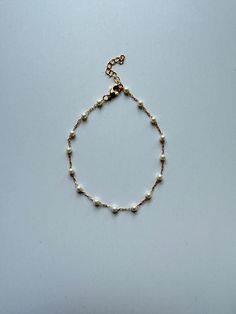 Rachael Pearl Bracelet. Delicate pearl and chain. Shown with additional pieces for styling inspiration but not included. 18kt gold filled chain Bracelet measures approximately 7” with 1.5: extender Gold filled lobster clasp Styling Inspiration, Layered Jewelry, Gold Filled Chain, Pearl Bracelet, Statement Jewelry, Ring Necklace, Chain Bracelet, Bracelets For Men, Ring Earrings