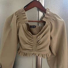 This Top Is Brand New Never Worn! Rouched Style With Tie At The Bottom. It Is A Cropped Length And Very Well Made In Lavish Alice Style! Smocked At The Back. The Cut Is Very Flattering. This Would Be So Cute With High Waisted Jeans Or Jean Shorts!! Fitted Ruched Beige Blouse, Fitted Beige Ruched Blouse, Rouched Top, Style With Tie, Lavish Alice, High Waisted Jeans, High Waist Jeans, Smocking, Jean Shorts