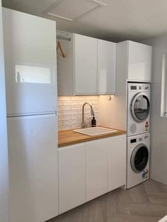 a washer and dryer in a small room