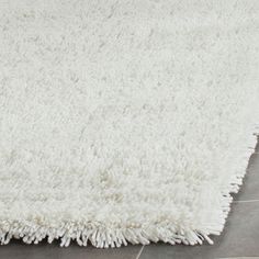 a white area rug on the floor