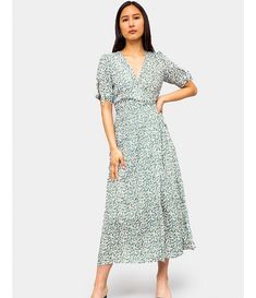 Noelle Midi Dress Flowy Wrap Midi Dress For Brunch, Flowy Midi Dress With Surplice Neckline, Spring Wrap Dress With Surplice Neckline, Spring Flowy Wrap Midi Dress, Casual Modest V-neck Midi Dress, Modest V-neck Midi Dress For Dress Down, Modest V-neck Midi Dress For Casual Wear, Spring Wrap Midi Dress, Spotted Dress