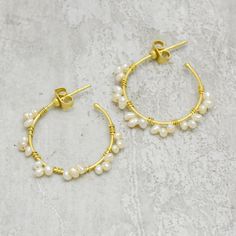 Each pearl is individually wrapped in a gold-plated circle hoop. you can wear these pearl circle earrings at parties, weddings, birthdays, etc. Will look amazing with just about any outfit you choose to pair them with, such as a pretty printed dress or jeans, a T-shirt, and a jean jacket. :-These earring is made of Pure Brass with 22k yellow gold plated  SKU:- A1E-8685 Metal:-Brass   Plating:- 22k gold  Earring dimension LXW:-  30X4 MM Gemstone: Pearl Gemstone Size: 4 MM Gross wt:- 1.5gm  :-Please check out our handmade jewelry collection https://www.etsy.com/shop/VcollectionJewelry?ref=seller-platform-mcnav I am specially making jewelry for Wholesale Orders. Top US, UK, and Australian handmade Jewelry Boutiques and chain stores are my wholesale customers. Wholesale prices are different Pl Dainty Gold Pearl Hoop Earrings, Gold Pearl Hoop Earrings For Anniversary, Handmade Pearl Hoop Earrings For Anniversary, Handmade Hoop Pearl Earrings For Anniversary, Gold Small Hoop Pearl Earrings For Anniversary, Dainty Pearl Chain Hoop Earrings As Gift, Gold Hoop Earrings For Wedding, Delicate Gold Hoop Pearl Earrings, Pearl Chain Hoop Earrings