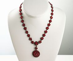 "Victorian Bohemian garnet necklace mounted in gilt silver in very fine condition. has detachable pendant. no markings. acid assayed for metal purity.. circa 1890 1\" diameter center medallion.  1 3/4\" long drop 24.2 gram total" Victorian Red Medallion Jewelry, Red Victorian Medallion Jewelry, Detachable Pendant, Wedding Necklaces, American Coins, Butterfly Pin, Garnet Necklace, Butterfly Brooch, Wedding Jewellery Necklace