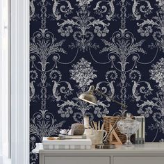 the wallpaper is blue and white with an intricate design on it's side