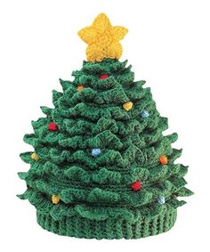 a crocheted christmas tree with lights on it's base and a star on top