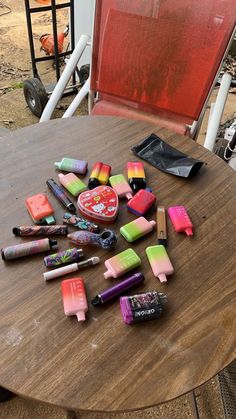 the table has many different colored items on it, including crayons and pens