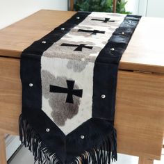 a black and white table runner with crosses on it