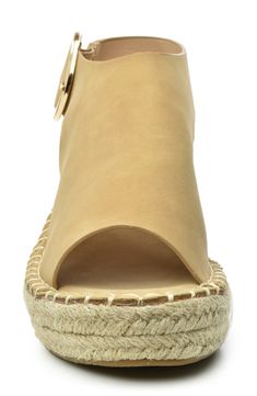 A woven espadrille wedge heel brings summery vibes to this chic sandal, finished with a peep toe and buckle strap closure. Sizing: True to size. 2.5" heel, 2" platform Espadrille wedge heel PU upper, manmade sole Imported This item cannot be shipped to Canada. Ankle Strap Espadrilles With Buckle Closure, Summer Open Toe Espadrilles With Woven Sole, Spring Vacation Espadrille Slingback Sandals, Espadrille Slingback Sandals For Spring Vacation, Beige Platform Sandals With Espadrille Material, Beige Platform Espadrille-style Sandals, Chic Open Toe Espadrilles For Summer, Beige Platform Espadrille Sandals, Chic Open Toe Straw Espadrilles