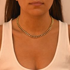 Show off your style in Em + Liv's Hollow Curb Chain. You can rock the hottest layered look when you style this piece with other chic necklaces and a cute blouse. Sterling Silver 14K Gold Plated Length: 14" + 2" Chic Curb Chain Necklace For Party, Party Cuban Link Chain Necklace With Adjustable Chain, Party Cuban Link Curb Chain Necklace, Party Cuban Link Necklace, Trendy Yellow Gold Curb Chain Necklace, Chic Choker Necklace With Curb Chain, Party Curb Chain Choker Jewelry, Party Choker With Curb Chain, Trendy Yellow Gold Clavicle Chain Necklace