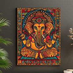 an elephant painting on the wall next to a potted plant